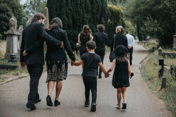 Family leaving the cemetery